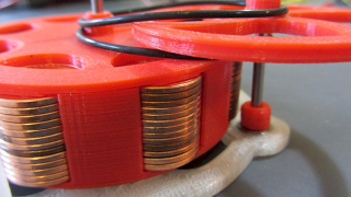 Illustration for article titled Got Loose Change? 104 Pennies Help This Simple 3D-Printed Toy Walk